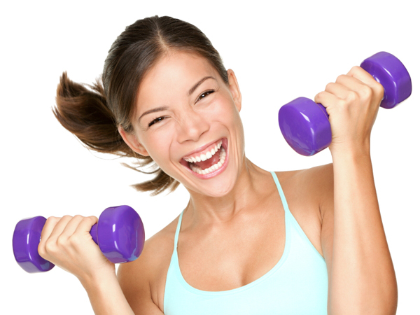 Happy fitness woman lifting dumbbells smiling cheerful, fresh and energetic. Mixed race Asian Caucasian fitness girl training isolated on white background.