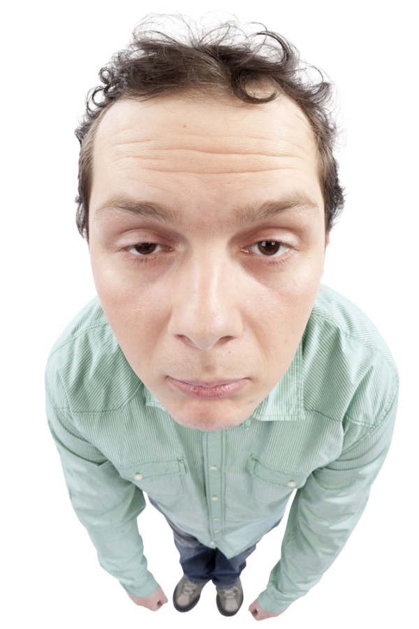 Full length view of a tired man. Fish-eye lens used. High resolution image taken in studio. Isolated on pure white background.