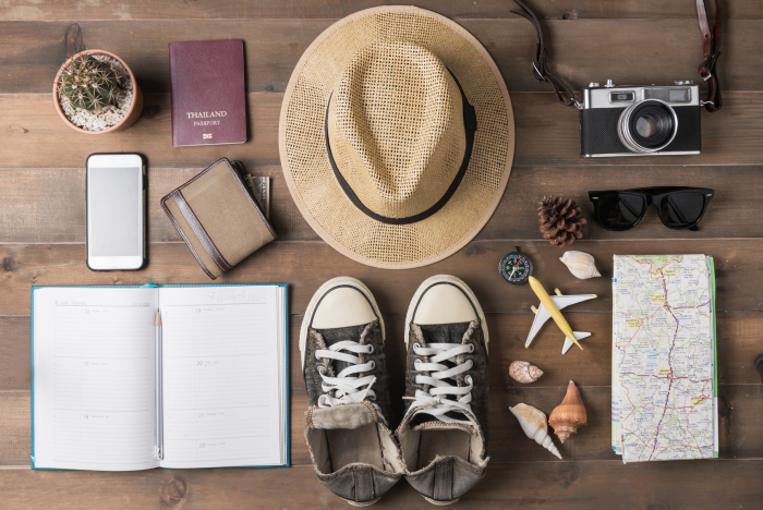Travel plan, trip vacation, tourism mockup - Outfit of traveler on wooden background. Flat lay.