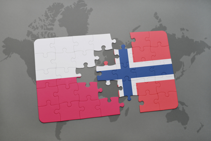 puzzle with the national flag of poland and norway on a world map background. 3D illustration