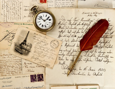 old letter and post cards with feather quill and wax seal. vintage background
