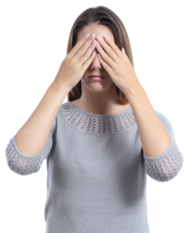 Woman covering her eyes with hands isolated on a white background