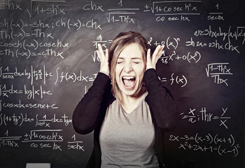 portrait of stressed teacher and blackboard background