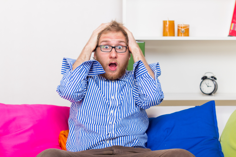 Shocked Man On The Couch at Room 