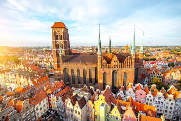 Cityscape aerial view on the old town with saint Marys church on the sunset in Gdansk, Poland